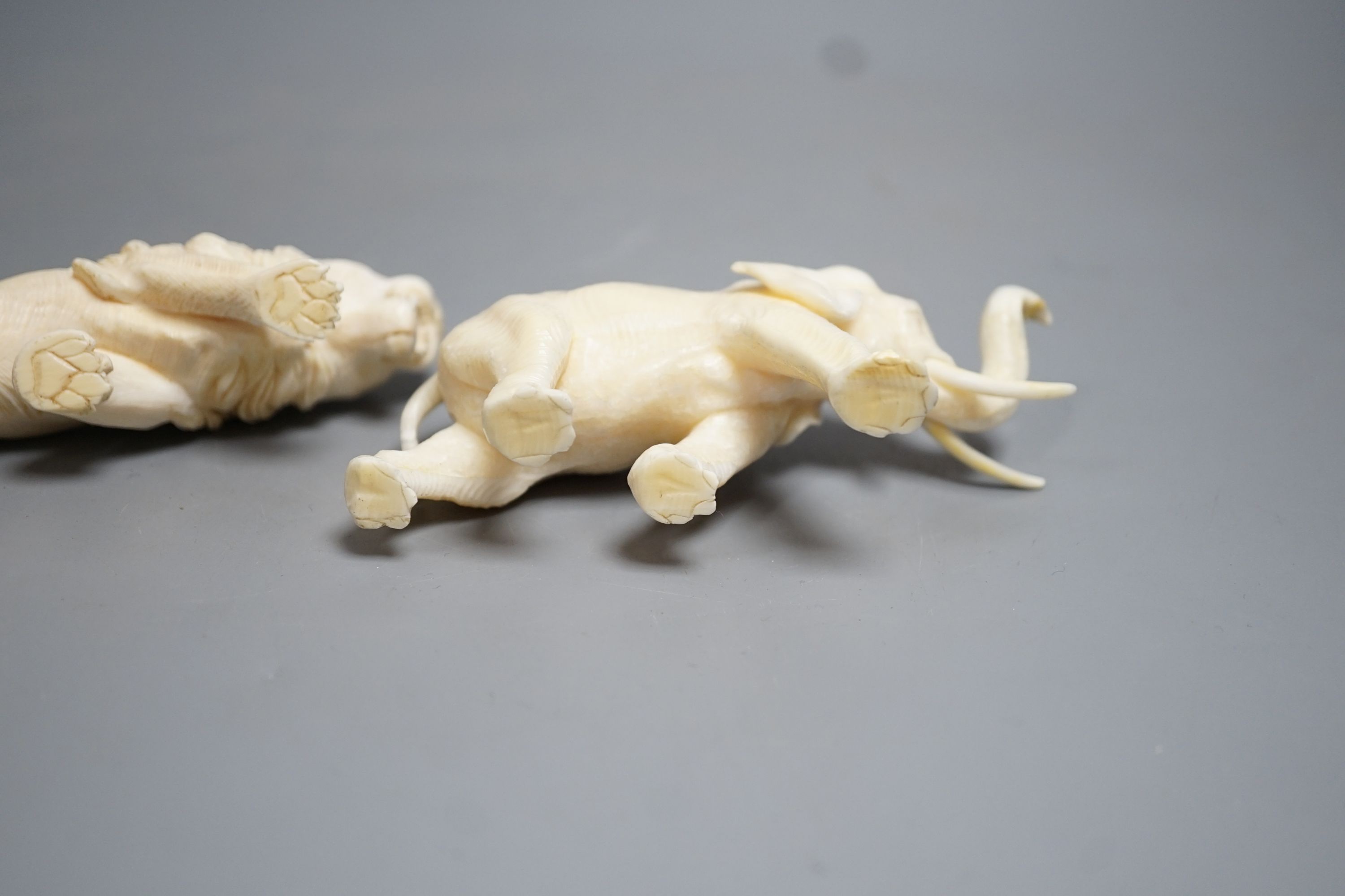 A Japanese Ivory model of an elephant and a similar Ivory model of a lion, early 20th century (2) lion 17cm long